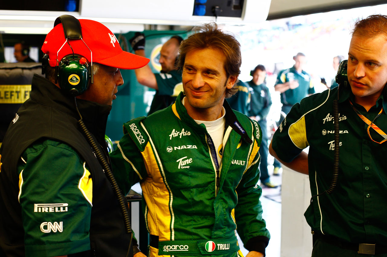 5695741771 80977f06e1 Tony Fernandes  Jarno Trulli And reliability engineer Mervyn Dempsey In The garage during qualifying O